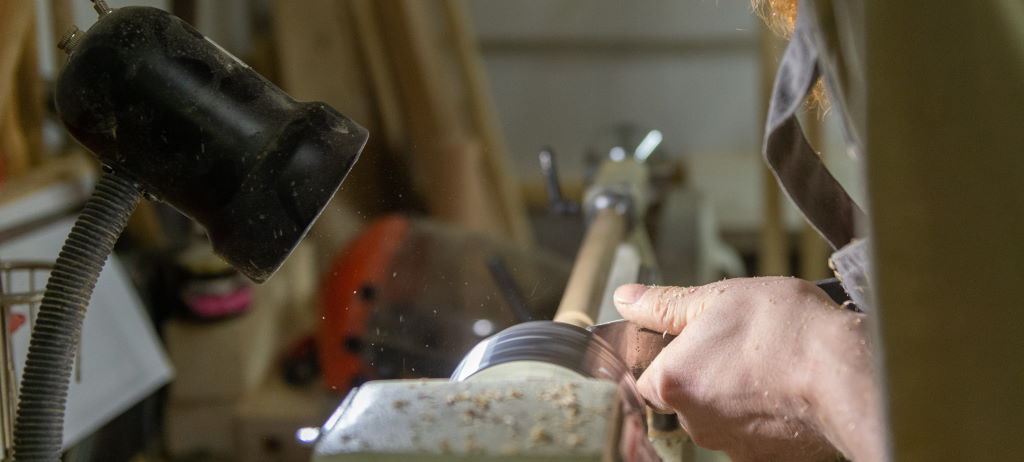 Image of a man working on a lathe by Anton Belitskiy taken from Pexels